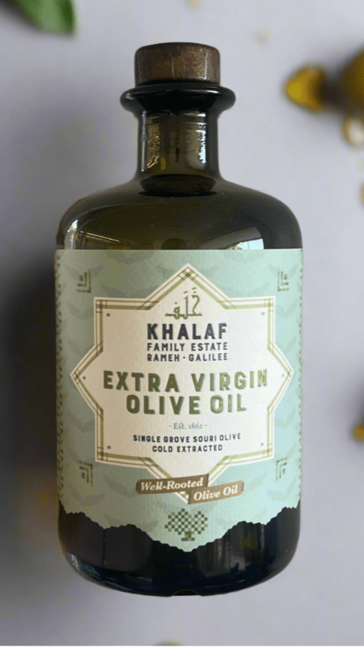 Premium 500ml bottle of extra virgin olive oil from Khalaf Olives, showcasing its rich golden color and elegant design that reflects the centuries-old Souri olive heritage and modern sustainable production practices